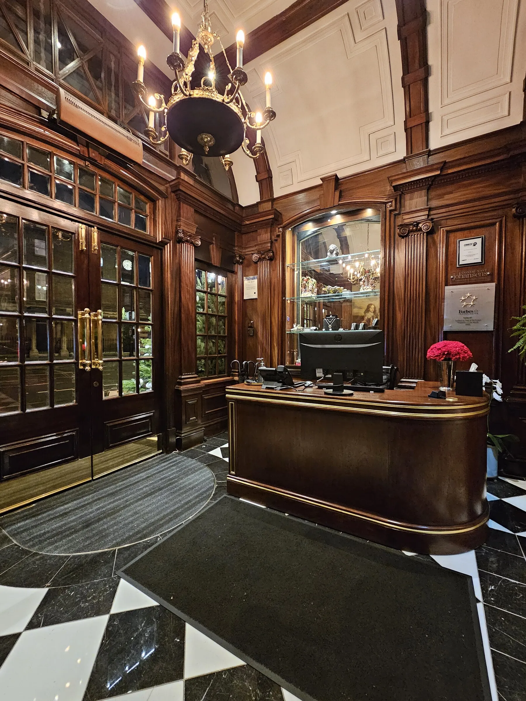 The wood-paneled reception desk at Hotel 41 in London